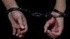A person in handcuffs at Moscow's Basmanny District Court