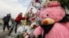 UKRAINE -- Ukrainians lay flowers and toys at a memorial for the victims of the fire in the shopping mall Zimnyaya Vishnya in the West Siberian city of Kemerovo, in front of the Russian embassy in Kiev, Ukraine, 27 March 2018. 