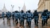RUSSIA -- Riot police block an area protecting against demonstrators during a protest against the jailing of opposition leader Alexei Navalny in Moscow, Russia, Sunday, Jan. 31, 2021