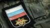 UKRAINE – Chevrons and patches of the Russian military after the battles in the Kyiv region, from where they were knocked out by the Armed Forces of Ukraine. The village of Moschun in the Buchan district of the Kyiv region. April 8, 2022 